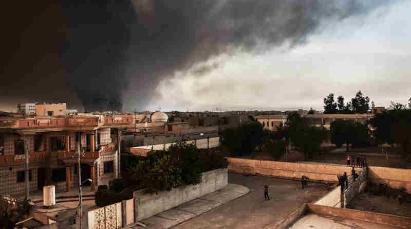 Oil wells set alight by ISIL are visible from the newly retaken Iraqi town of al-Hud, outside Mosul, where IOM distributed 350 non-food item kits to recently displaced families. UN Photo: IOM / Jennifer Sparks (representational image)