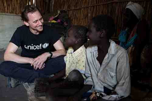 UNICEF Ambassador Tom Hiddleston meets brothers Buom, 12 (right) and Jal, 9, who have been separated from their mother since the conflict began in 2013, at the Protection of Civilians camp in Bentiu, South Sudan, on 25 November 2016.