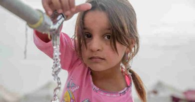 A young girl from Mosul takes water from a tap stand at a UNICEF-supported Temporary Learning Space in Hassan Sham Displacement Camp, Ninewa Governorate. Photo: UNICEF (Representational image)