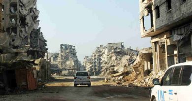 UN vehicles travel along a road lined with remnants of destroyed buildings, Homs, Syria. (file) Photo: UNICEF / UNI178367/ Tiku (file photo)