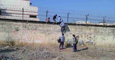 Students of a government school in Delhi cross high walls and barbed wires to abscond from the school. School education is bad and teachers have no control on students. Photo: Rakesh Raman / RMN News Service