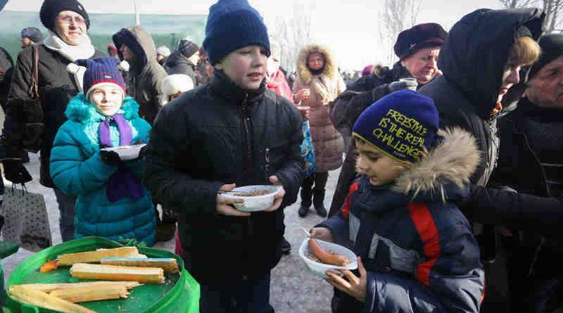 On 1 February 2017, children eat a hot meal at a heated emergency shelter in freezing cold Avdiivka, Ukraine, following intense fighting at the end of January 2017. Photo: UNICEF/Aleksey Filippov