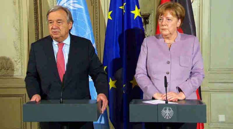 Secretary-General António Guterres (left) at a press encounter alongside German Chancellor Angela Merkel.