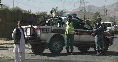 An Afghan traffic policeman controls a traffic jam in Maidan Shar. Photo UNAMA / Fardin Waezi.