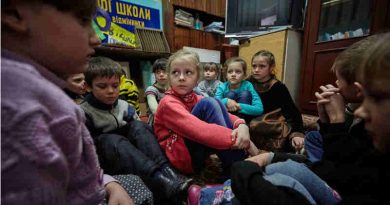 On 13 February 2017, first-grade students in eastern Ukraine, including 6-year-old Sasha (in red sweater), participate in a drill to practice their response to a shelling. Photo: UNICEF / UN053119 / Zmey