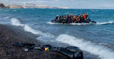 Newly arriving refugees wave and laugh as the large inflatable boat they are in approaches the shore, near the village of Skala Eressos, on the island of Lesbos, in the North Aegean region of Greece. Photo: UNICEF/Ashley Gilbertson VII