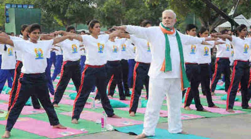 Narendra Modi Playing Yoga Tricks. Photo: Press Information Bureau