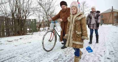 On 13 February 2017, Nina (left) and her granddaughters, Diana (right), 14, and Sasha (center), 6, leave their home in Ukraine to collect water from the well located on the outskirts of the village. Photo: UNICEF (file photo)