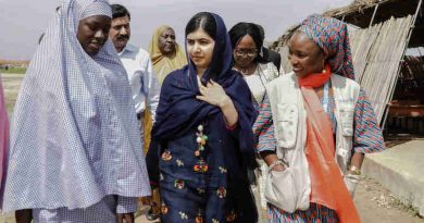 On 18 July 2017 in Maiduguri, Malala Yousafzai (center) is shown around the school in Bakassi camp by student, Fatima Grema (left) who has been displaced by the conflict in northeast Nigeria. During her visit to Nigeria, education activist Malala Yousafzai met with girls displaced by the Boko Haram crisis.