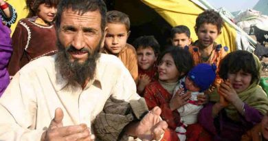 Afghan refugees sit outside their tent in Islamabad, Pakistan. Photo: UNHCR/A. Shahzad (file photo)