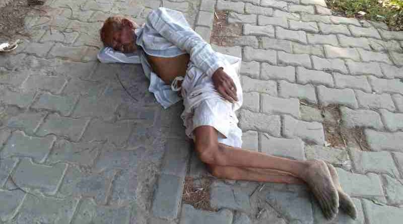 A homeless man sleeping on a road in Delhi. Political and bureaucratic corruption is the main cause of poverty, pollution, sickness, and hunger in India. Photo: Rakesh Raman / RMN News Service