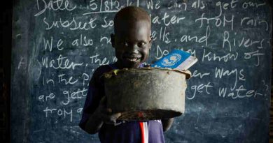 On 15 August 2016 in the Bentiu Protection of Civilians site (POC) in Unity State, Maet, 6, carries an old broken saucepan with a hole in it to school so he has something to sit on during class. Photo: UNICEF