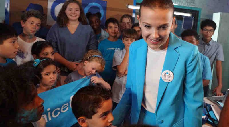 UNICEF supporter Millie Bobby Brown on the set of a video produced for World Children's Day 2018 on 24 August 2018 in New York City in the United States of America. Actor Millie Bobby Brown has teamed up with UNICEF Goodwill Ambassadors Orlando Bloom, Liam Neeson and Lilly Singh; singer-songwriter Dua Lipa and performance artists the Blue Man Group, in a new video released by UNICEF ahead of World Children’s Day, celebrated on 20 November 2018. The short video shows the 14 year-old star – who has symbolically changed her name to Millie Bobby ‘Blue’ to mark the occasion – overseeing a global ‘go blue’ operation. Alongside her team of young helpers, Millie calls on fellow UNICEF Goodwill Ambassadors and supporters to join her in going blue – by wearing or displaying the colour blue – in support of children’s rights. As the story unfolds, viewers see the stars responding to Millie’s call while going about their daily lives. Liam Neeson bakes blue cupcakes while reenacting a famous scene from his cult-hit Taken, Dua is in studio re-recording the lyrics of her global hit Be The One from red to blue, Orlando is on a film set working under his new name – Orlando ‘Bluem’ – and Lilly is at home making ‘blunicorn’ smoothies. UNICEF’s annual World Children’s Day is commemorated each year on 20 November and marks the anniversary of the adoption of the Convention on the Rights of the Child. The global day raises awareness and vital funds for the millions of children who are unschooled, unprotected and uprooted. This year, UNICEF is inviting the public to go online and sign its global petition asking for leaders to commit to fulfilling the rights of every child now and for future generations, and to Go Blue for every child by doing or wearing something blue on 20 November.