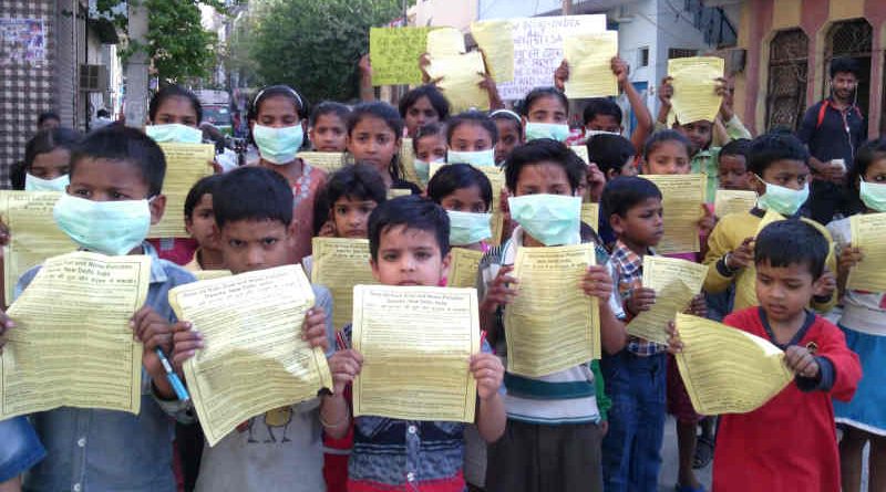 Children of RMN Foundation free schools distributing pamphlets during an environment protection campaign, urging the Delhi government to save them from pollution. But the careless government is not taking any steps to stop pollution. Campaign and photo by Rakesh Raman, founder of the humanitarian organization RMN Foundation.