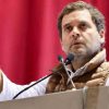 A candid shot of Rahul Gandhi speaking forcefully into a microphone, capturing the theatrical intensity of his high-visibility, low-impact opposition rhetoric.