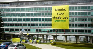 Plastic Monster Action at Nestlé Headquarters in Switzerland. Greenpeace activists deliver a 20-meter-long “plastic monster” covered in Nestlé branded plastic packaging to the company‘s global headquarters. Greenpeace is calling on Nestlé to end its reliance on single-use plastic. 16 April, 2019. Photo: Yukon Benner / Greenpeace