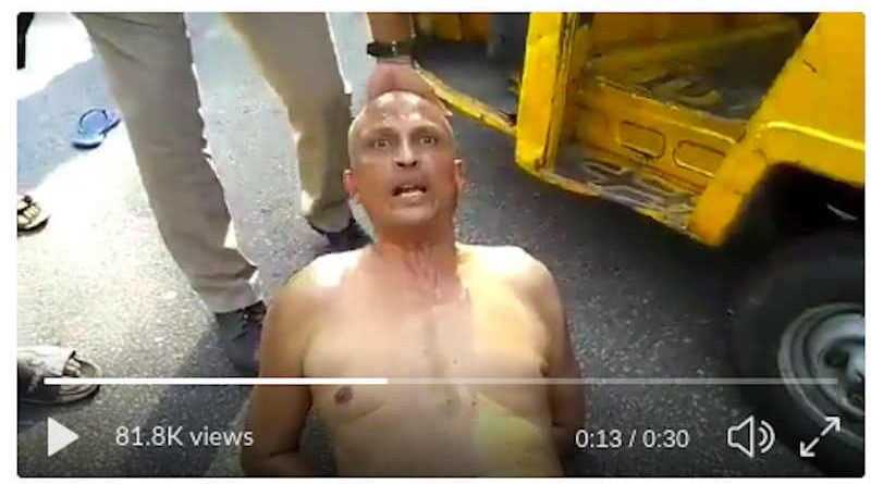 Dr Sudhakar Rao dragged on the road. Photo: Screengrab from Twitter video.