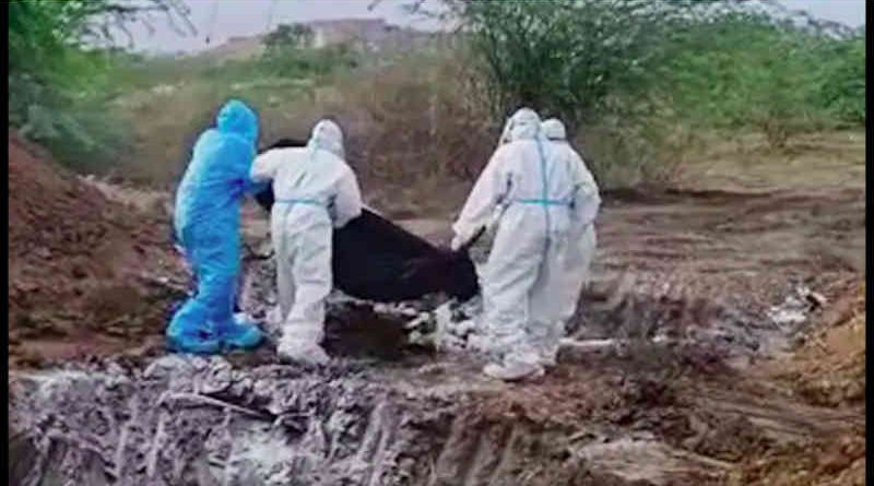 Dead bodies wrapped in a plastic cover were tossed into a pit for burial. Screengrab