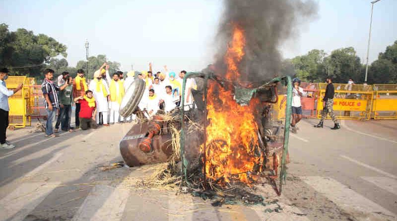 Protesters burn a tractor in New Delhi on September 28, 2020 to oppose the farm laws introduced by the Modi government. Photo: Indian Youth Congress