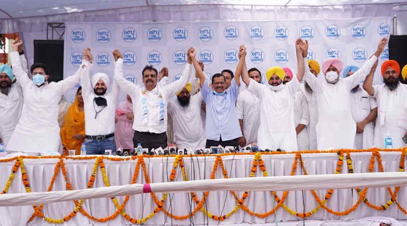 Aam Aadmi Party (AAP) chief Arvind Kejriwal with Bhagwant Mann and other local politicians in Punjab on June 21, 2021. Photo: AAP (file photo)