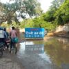 Delhi Jal Board signboard at a hazardous Dwarka sewer repair site.